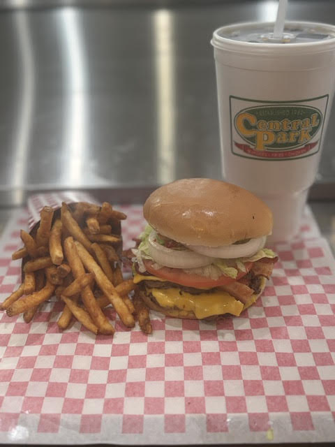 A Central Park combo: a cheeseburger with lettuce, tomato and onion, seasoned fries and a fountain drink
